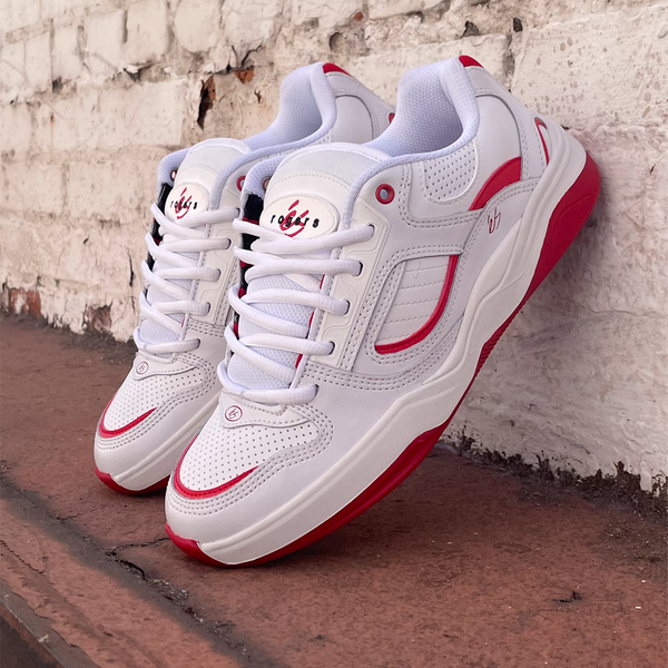 éS TJ Rogers Blanc/Rouge signature skate shoe photographed in profile, showcasing red detailing, triple-stitched toe, and low-cut silhouette on a clean white background.