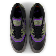 Pair of black and gray sneakers with purple accents on a white background